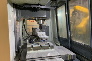 A push pad in the toolchanger ensures the part is fully seated in the jaws
